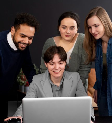trans-person-working-office-with-colleagues-1